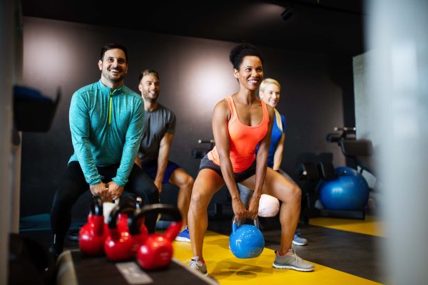 group-of-sportive-people-in-gym-happy-fit-friends-2025-03-13-21-48-59-utc